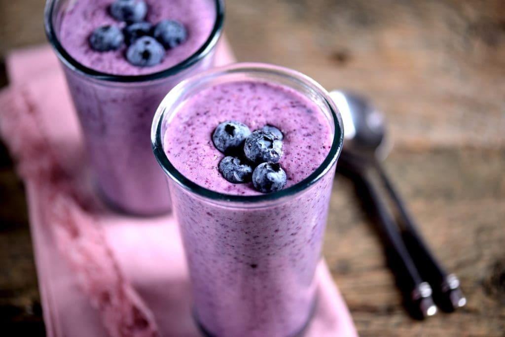Why blueberry kefir smoothie? Healthy blueberry kefir smoothie in a glass with fresh blueberries and chia seeds – a probiotic-rich, anti-inflammatory smoothie recipe perfect for gut health and daily wellness.