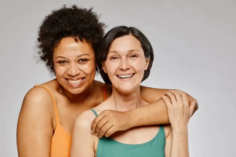 Two women smiling.